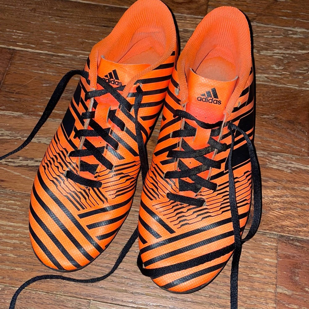 Fluorescent orange Adidas soccer cleats